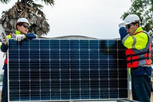 Workers Technicians are working to construct solar panels system on construction site. engineers are checking before Instal solar photovoltaic panel system. Renewable clean energy technology concept. photo