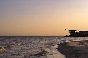 Sunset beach. Beautiful sunset on the deserted beach. photo