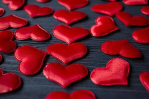 Red love hearts on a blue wooden background. Valentine's Day 2019. Background for greeting card. photo