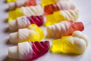 Bright candies on a white background, close up. photo