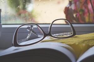 Eye glasses on the book close up. photo