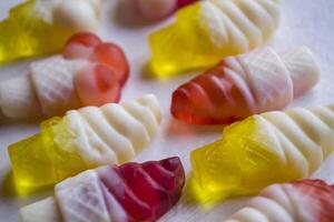 Bright candies on a white background, close up. photo