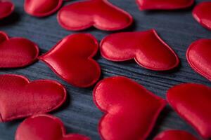 Red love hearts on a blue wooden background. Valentine's Day 2019. Background for greeting card. photo