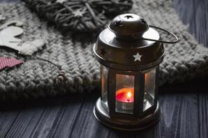 Metal candle lantern in a cozy home. Details of home decor. photo