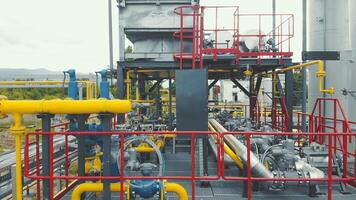 Aerial view Gas production station. Metal construction with valves on the pipes. Distribution and equipment for gas production. video