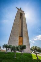 The Christ the King statue in Lisbon, Portugal photo