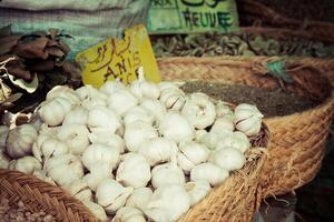 Beautiful vivid oriental market with baskets full of various spices photo