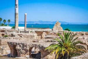 Ancient ruins at Carthage, Tunisia with the Mediterranean Sea in the background photo