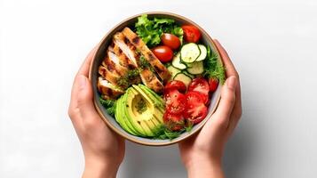 AI generated hands holding a bowl of salad with chicken, avocado, tomatoes and cucumber photo