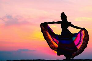 AI generated Woman Standing on Top of Hill With Colorful Skirt photo