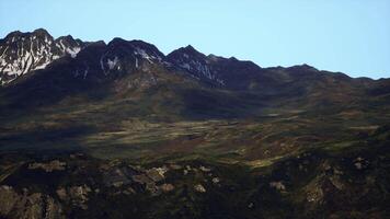 A breathtaking mountain range under a clear blue sky video