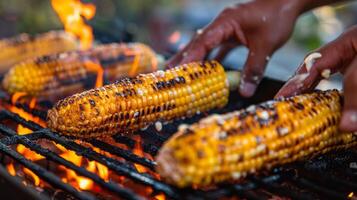 AI generated BBQ party with hands grilling and buttering corn on the cob. photo