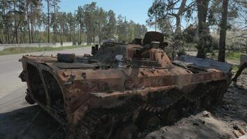 Burnt and destroyed armored personnel carrier of the Russian army as a result of the battle with the Ukrainian troops. Russian aggression in Ukraine. Ukraine is waging a liberation war with Russia. video