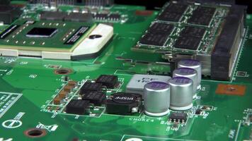 Circuit board background of PC computer motherboard. Computer circuit board close up, electronic technology background video