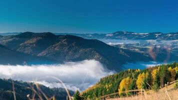 Time lapse of Clouds move in Carpathian mountains. Zoom out. 4K video