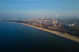 Baltic sea shore with view of Gdansk city, aerial view photo