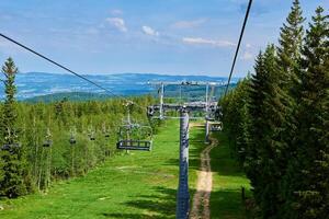 Mountains with open cable cars lift, Karpacz, Poland photo