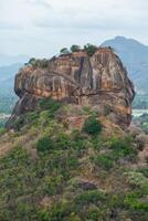 Scenery view of Sigiriya rock an iconic tourist destination and one of UNESCO world heritage site in Sri Lanka. photo