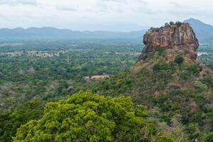 Scenery view of Sigiriya rock an iconic tourist destination and one of UNESCO world heritage site in Sri Lanka. photo
