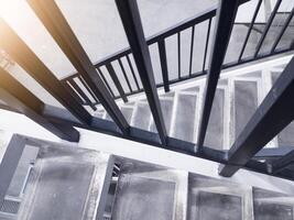 Interior of the stairs leading to the top floor in an industrial office building. photo