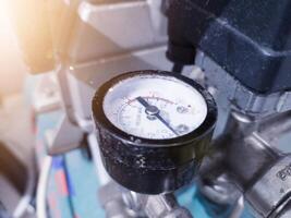 Pressure gauge  and safety valve for measurement air compressor. photo