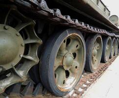 The chassis of an old battle tank that has not been used for a long time photo