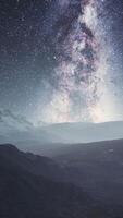 camera follow the Milky Way rotate in mountains video