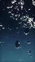 flying through the asteroid belt in outer space, vertical video