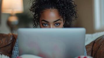 AI generated Woman Sitting on a Couch Using Laptop Computer photo