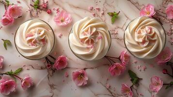 AI generated Three Cupcakes With White Frosting and Pink Flowers photo