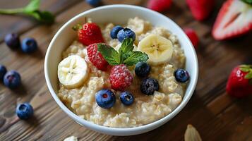 AI generated Simple delicious porridge with berries and bananas in a white bowl. Generated by artificial intelligence. photo