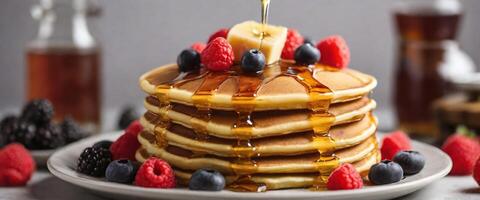 AI generated stack of pancakes with maple syrup and fruit toppings served on white plate photo