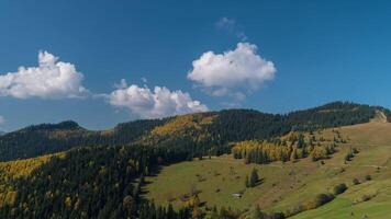 Time lapse of Clouds move in Carpathian mountains. Zoom out. 4K video