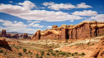 ai generado un asombroso panorama de un cañón con impresionante arcos y rocas contrastando con un brillante cielo y nubes foto