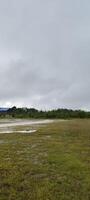 beautiful scene of pitch with cloudy sky photo