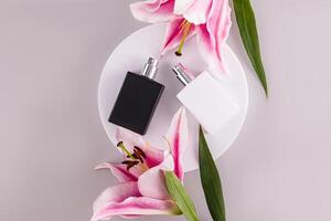 Black and white matte bottles of perfume with a natural smell of freshness lie on a white round podium. A fragrance for you and him. Top view. photo