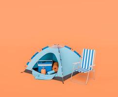 Camping Tent with Accessories and Striped Chair on Orange Background photo