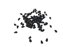 Black cumin seeds pile isolated on white background photo