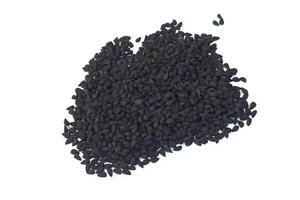 Black cumin seeds pile isolated on white background photo