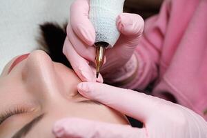 Close-up of cartridges with a needle which perform permanent makeup of eyelashes. Permanent eye makeup and PMU eyelashes photo