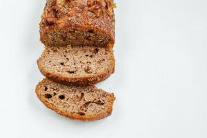 sliced banana bread isolated on white background with copy space. photo