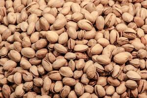 Pistachio nuts background. Healthy food. Close up. photo