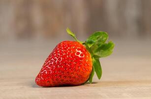 Strawberry on a wooden background with copy space for text. photo