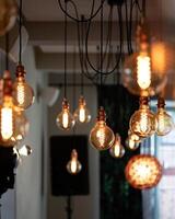 Vintage incandescent Edison light bulbs decorating the room. photo