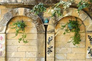 Ancient Stone Fountain with Decorative Blue Owl photo