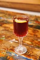 Crystal Glass with Refreshing Beverage and Lemon Slice photo