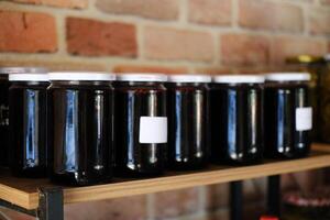 Assorted Dark Fruit Jams in Glass Jars photo