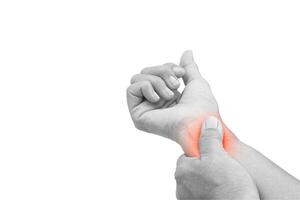 Woman with pain in wrist on white background with clipping path. Healthcare and office syndrome concept. photo