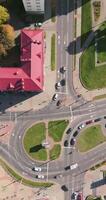 vertical accelerated aerial video above road junction with heavy traffic