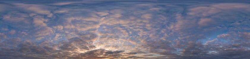 Golden sunset sky panorama Seamless spherical equirectangular 360-degree view with beautiful Stratocumulus clouds, setting sun - for use in 3D graphics as a sky dome or post-processing of drone images photo